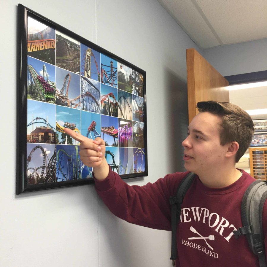 Senior Charlie Rau, 18, discusses roller coasters in front of a picture collage of his favorite rides.