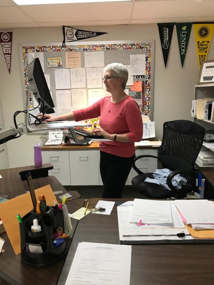 Guidance department secretary Cindy Berardinelli recently started using a standing desk, and touts benefits of her new perspective on work.