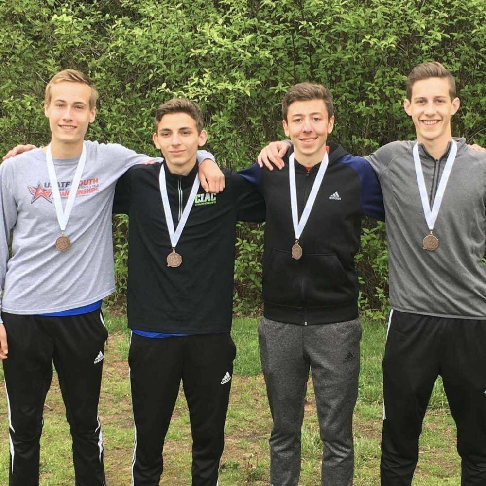 Senior+Nick+OBrien%2C+second+from+right%2C+poses+with+members+of+the+Mills+4X800+relay+team.+Contributed+photo