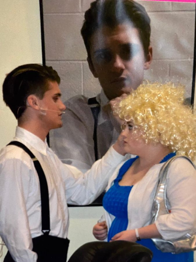 Freshman Ian Markowich, left, acts alongside junior Maeve Tucker recently in the school musical 9 to 5.