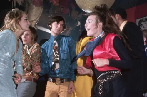 People dancing and listening to live music in an early American nightclub